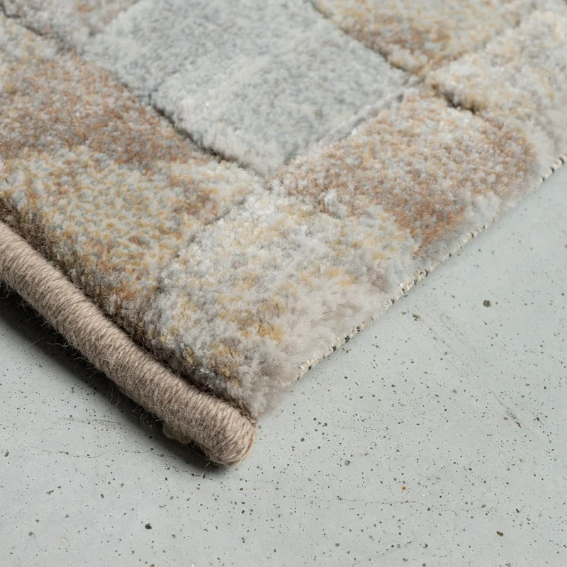 Tapis beige/gris cube